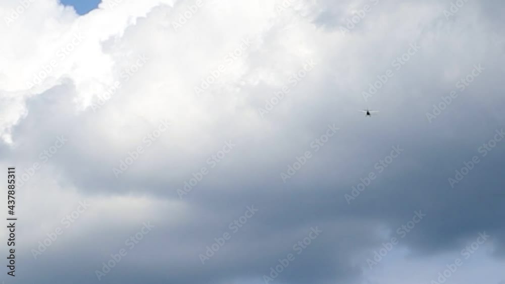 Ultralight small propeller-driven private jet flying in the sky with clouds over the airfield. Rear view of a turboprop aircraft taking off Ultralight small propeller-driven private jet flying in the sky with clouds over the airfield. Rear view of a turboprop aircraft taking off