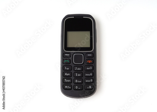 Old and outdated mobile phone isolated on white background.