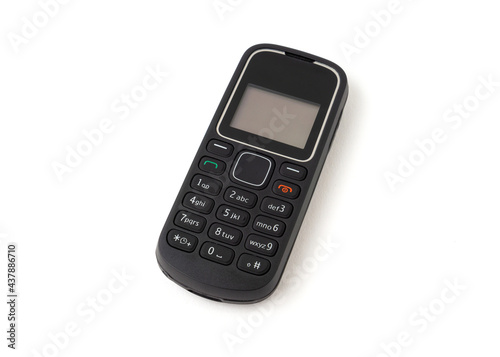 Old and outdated mobile phone isolated on white background.