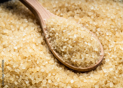 wooden spoon with demerara brown cane sugar