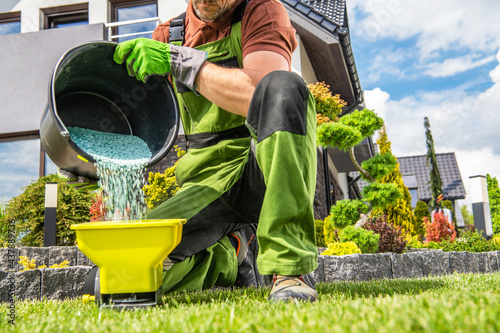 Garden Worker Preparing Grass Fertilizer