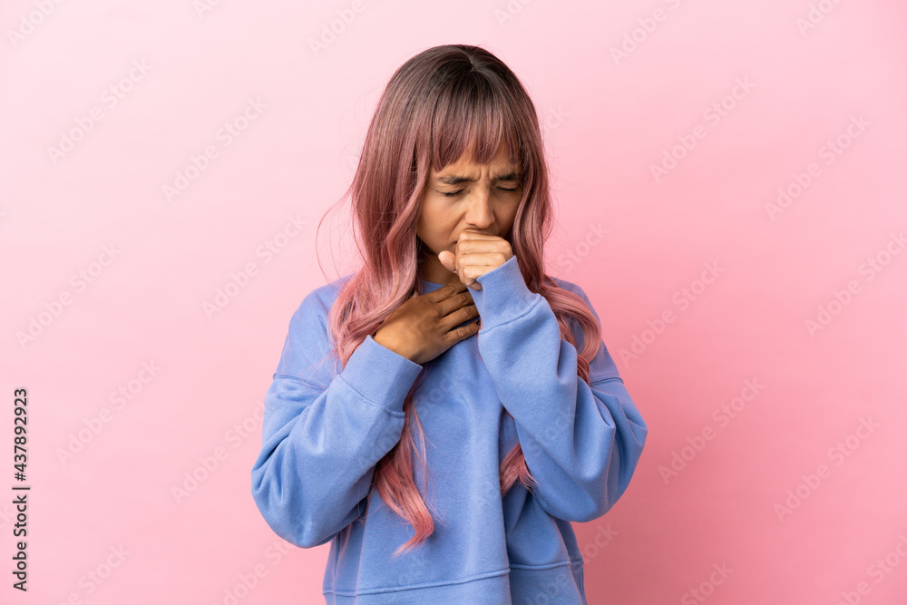 Young mixed race woman with pink hair isolated on pink background coughing a lot Young mixed race woman with pink hair isolated on pink background coughing a lot