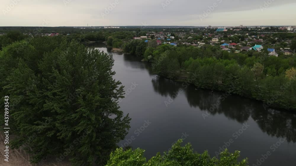 drone flying over the trees in front of the river. aerial footage 4k drone flying over the trees in front of the river. aerial footage 4k