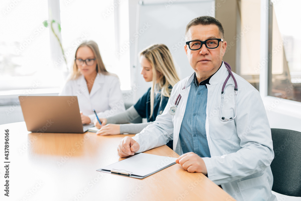 Medical doctors team having a meeting in conference room in hospital Medical doctors team having a meeting in conference room in hospital