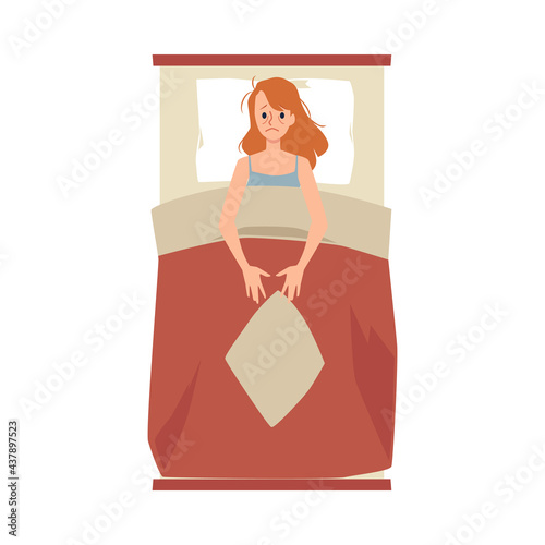 Young tired woman lying in bed at night suffers from insomnia or stress.