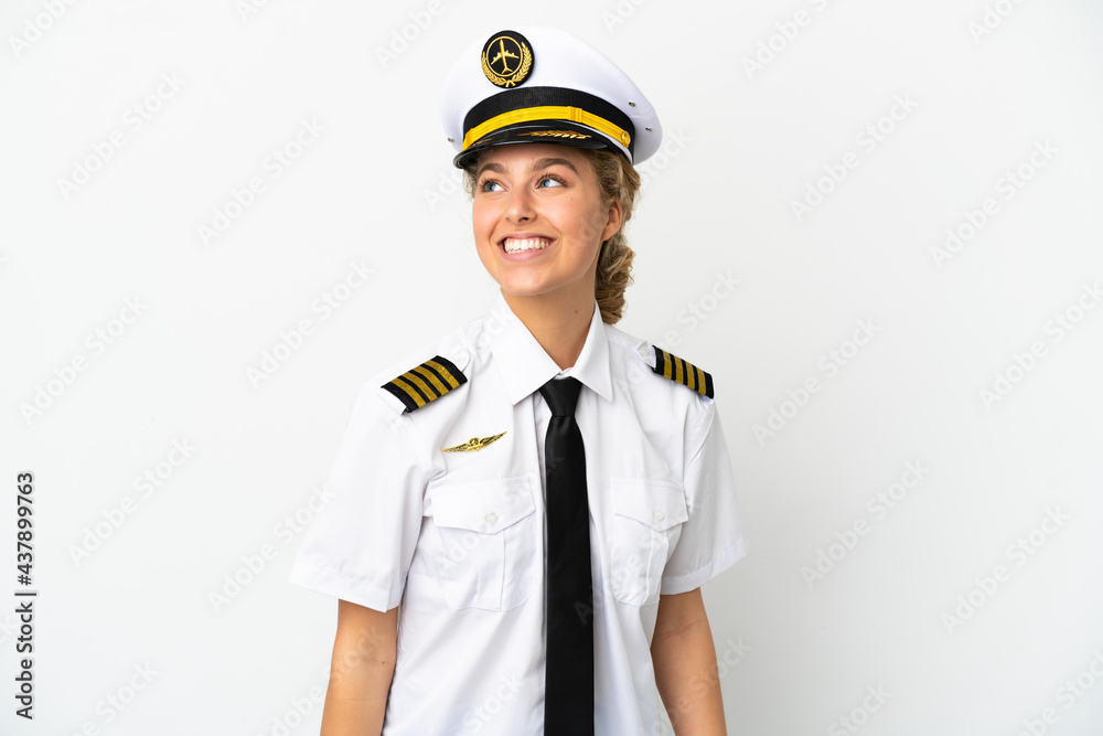 Airplane blonde woman pilot isolated on white background thinking an idea while looking up Airplane blonde woman pilot isolated on white background thinking an idea while looking up
