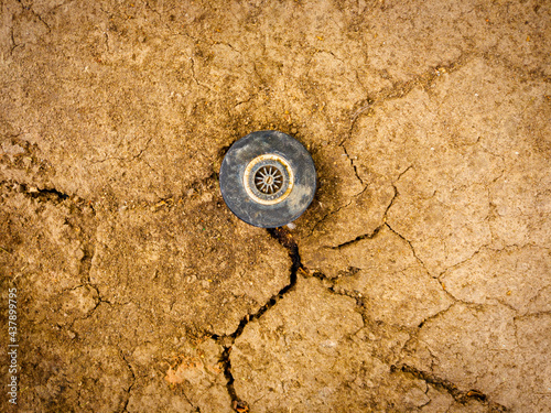 Fotografija Sprinkler head on dry soil top view