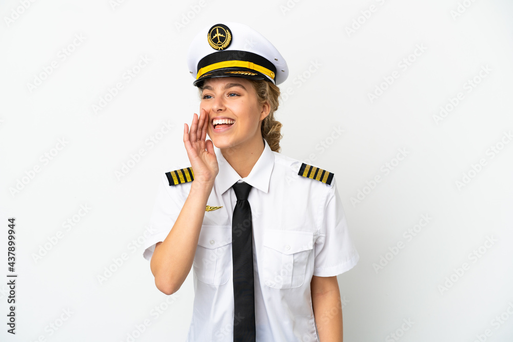 Airplane blonde woman pilot isolated on white background shouting with mouth wide open to the side Airplane blonde woman pilot isolated on white background shouting with mouth wide open to the side