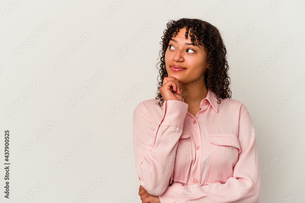 Young mixed race woman isolated on white background looking sideways with doubtful and skeptical expression. Young mixed race woman isolated on white background looking sideways with doubtful and skeptical expression.