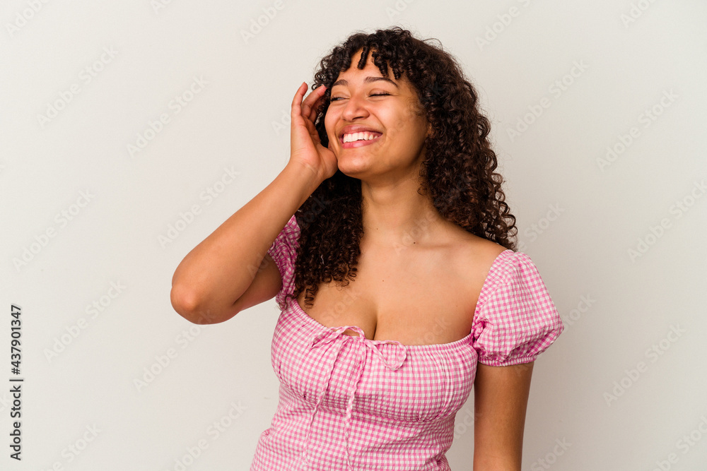 Young mixed race woman isolated on white background joyful laughing a lot. Happiness concept. Young mixed race woman isolated on white background joyful laughing a lot. Happiness concept.