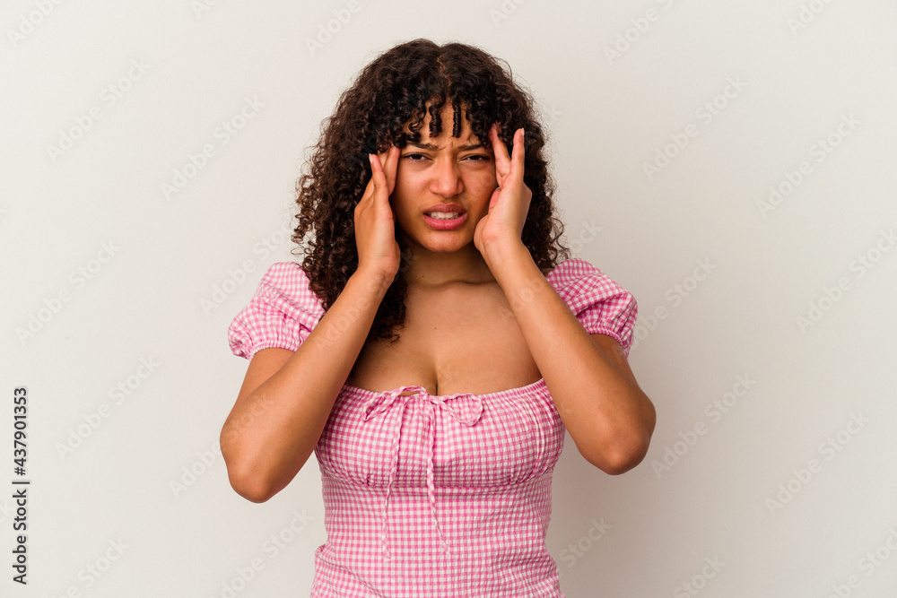 Young mixed race woman isolated on white background having a head ache, touching front of the face. Young mixed race woman isolated on white background having a head ache, touching front of the face.