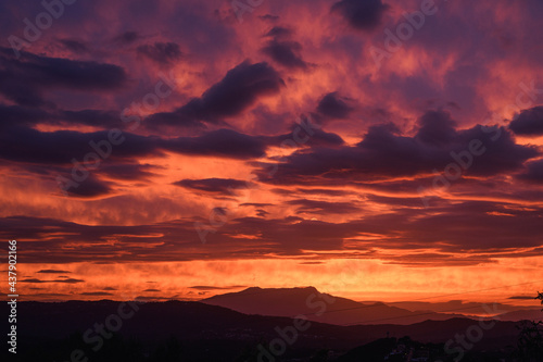 Beautiful red sunset with clouds overlooking the Montseny mountain in Spain.