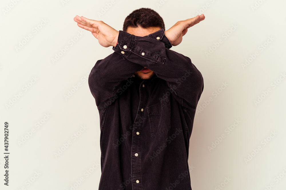 Young caucasian man isolated on white background keeping two arms crossed, denial concept. Young caucasian man isolated on white background keeping two arms crossed, denial concept.