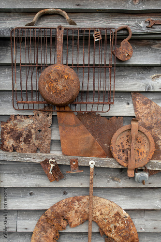 Old rusty items on wooden wall