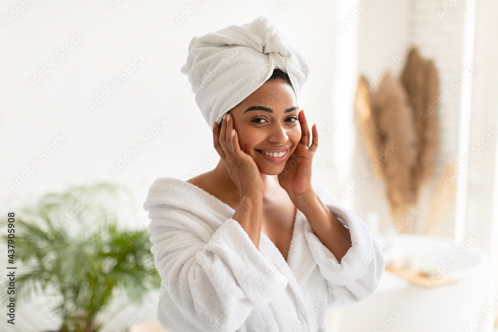 Pretty African American Lady Touching Face Smiling Posing In Bathroom Pretty African American Lady Touching Face Smiling Posing In Bathroom