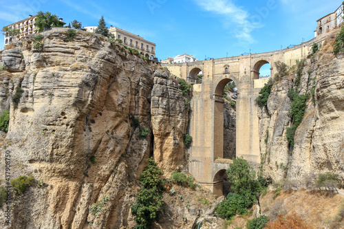 Beautiful city of Ronda situated in province of Malaga. View of the "Puente Nuevo" the newest and largest of three bridges that spanned the 120-metre-deep. Touristic travel destination in Andalucía