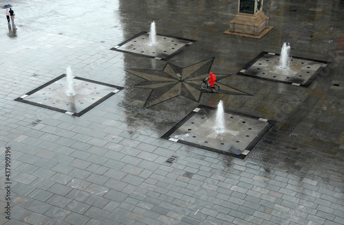 the beautiful pavement of Piazza Castello in Turin made shining from the rain in a suggestive atmosphere