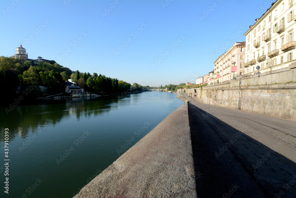 metaphysical charm of the river Po in the center of Turin on the Murazzi bank.