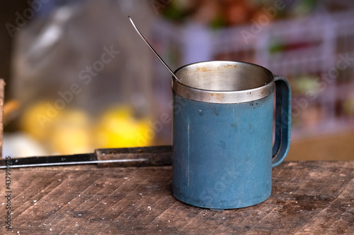 Classic blue mug putting on the wooden table