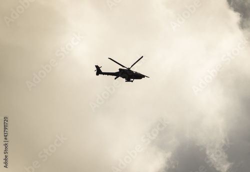 AH-64 Apache is a modern attack  antitank helicopter used by the US military. Helicopter in flight. Romania, Gorj. June, 07, 2021.
