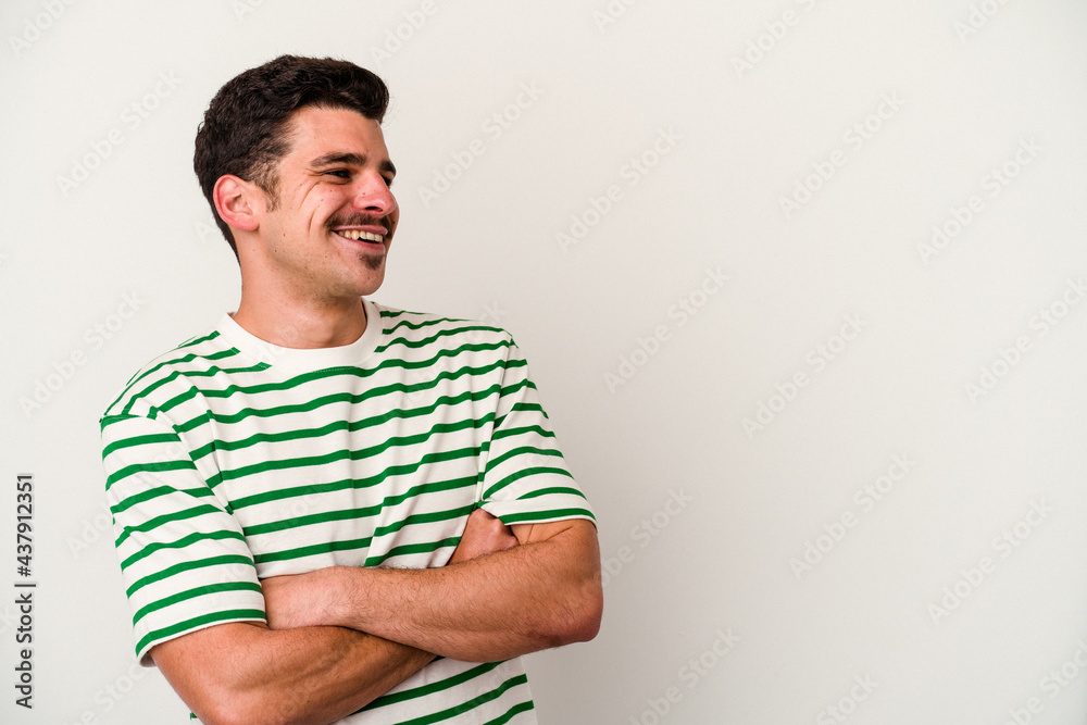 Young caucasian man isolated on white background smiling confident with crossed arms. Young caucasian man isolated on white background smiling confident with crossed arms.