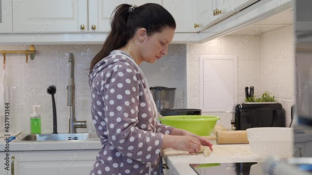 Woman cooking food in the modern kitchen, meat filled dumplings manti preparation. High quality 4k footage Woman cooking food in the modern kitchen, meat filled dumplings manti preparation. High quality 4k footage