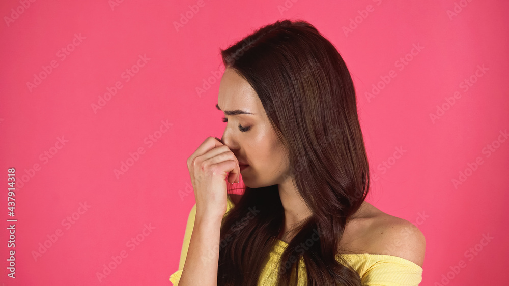 sad young adult woman with closed eyes and hand near face isolated on pink sad young adult woman with closed eyes and hand near face isolated on pink