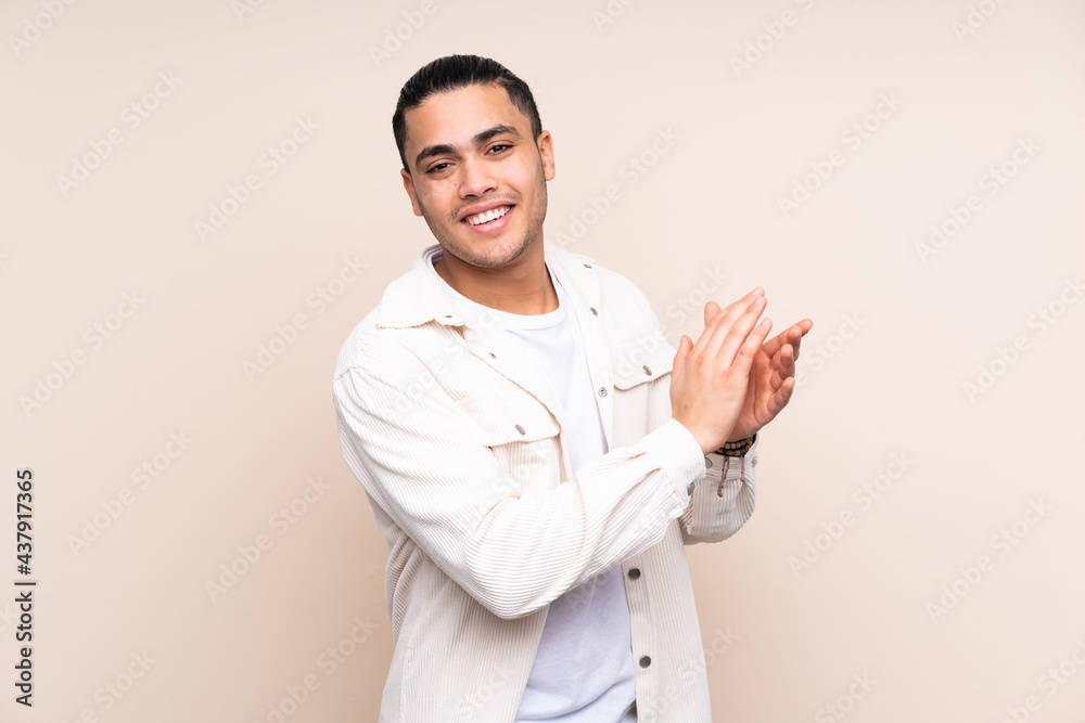 Asian handsome man over isolated background applauding Asian handsome man over isolated background applauding