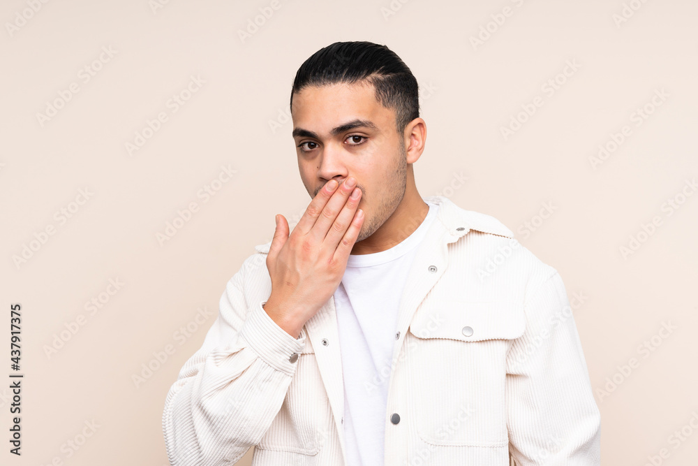 Asian handsome man over isolated background happy and smiling covering mouth with hand Asian handsome man over isolated background happy and smiling covering mouth with hand