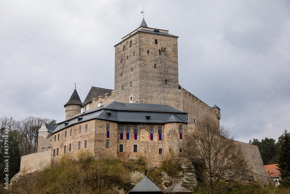 Medieval gothic castle Kost or Bone with tower in spring day, ancient fortresses on hill, fairytale stronghold, landmark in countryside, Bohemian Paradise or Cesky Raj, Czech Republic