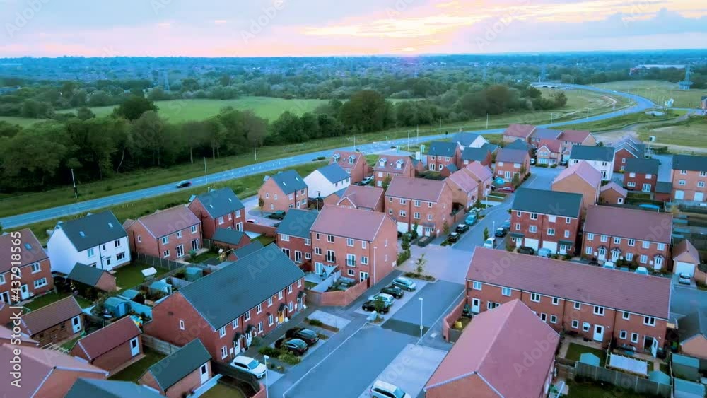 Aerial shot revealing large new build home development site.