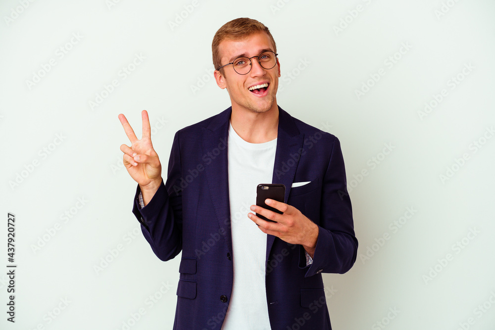 Young business man holding a phone isolated on white background Young business man holding a phone isolated on white background