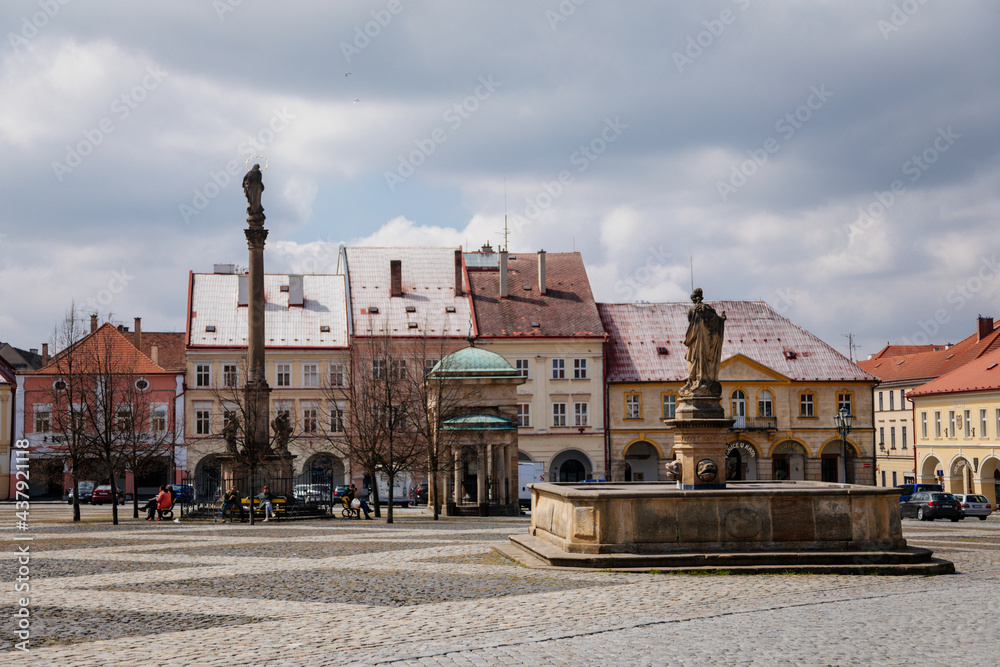 Town Wallenstein square with colorful renaissance historical buildings, baroque meteorological column, fountain, Marian Column, sculptural group of  Virgin Mary, Jicin, Czech Republic