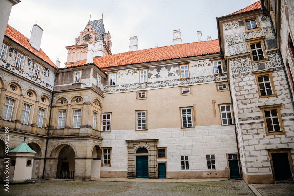Gothic Castle Brandys nad Labem, Renaissance palace, clock tower, Historical Courtyard with sgraffito mural decorated plaster at facade, wall decor, Central Bohemian, Czech Republic