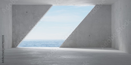 Fototapeta Naklejka Na Ścianę i Meble -  Abstract empty, modern concrete room with diagonal wall opening with ocean view on the back wall and rough floor - industrial interior background template