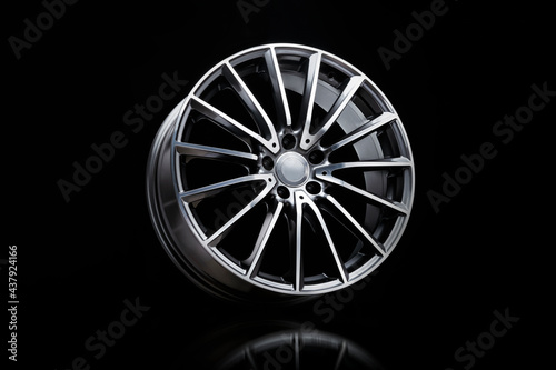 sporty alloy wheels . the rim on a black background. car tuning auto parts