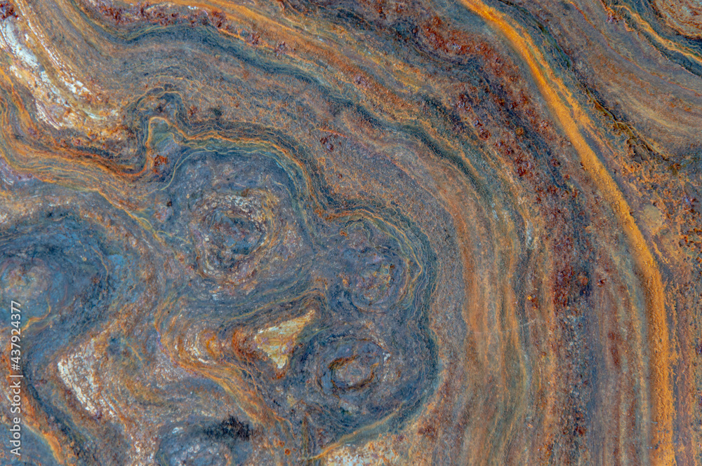 grunge background: curly rust on an old metal surface, toning grunge background: curly rust on an old metal surface, toning