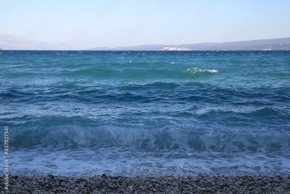 Waves on a beach in Croatia. Selective focus.