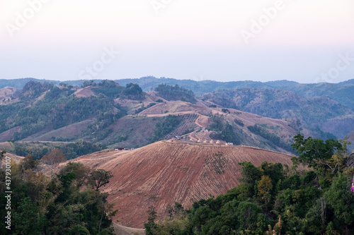 View from mountain top, with liitle houses on the hill. Landscape and nature.