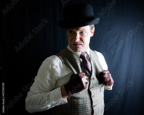 Foto Portrait of Man in Vest and Bowler Hat With a Mean Expression
