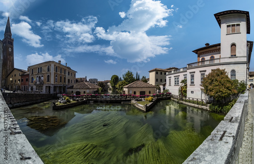 Portogruaro panorama completo con i molini sul fiume Lemene, oratorio della Madonna della Pescheria e il terzo campanile più pendente d'Italia photo