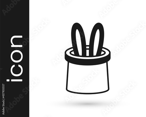 Black Magician hat and rabbit ears icon isolated on white background. Magic trick. Mystery entertainment concept. Vector