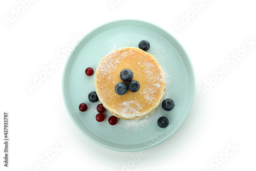 Plate with delicious pancakes isolated on white background