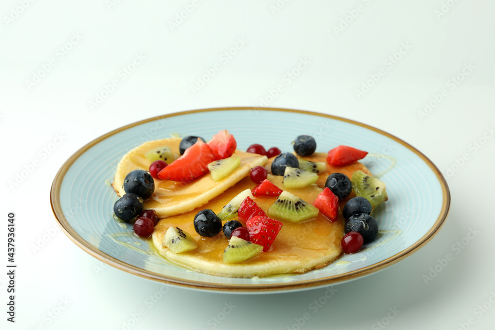 Concept of delicious dessert with pancakes on white background Concept of delicious dessert with pancakes on white background