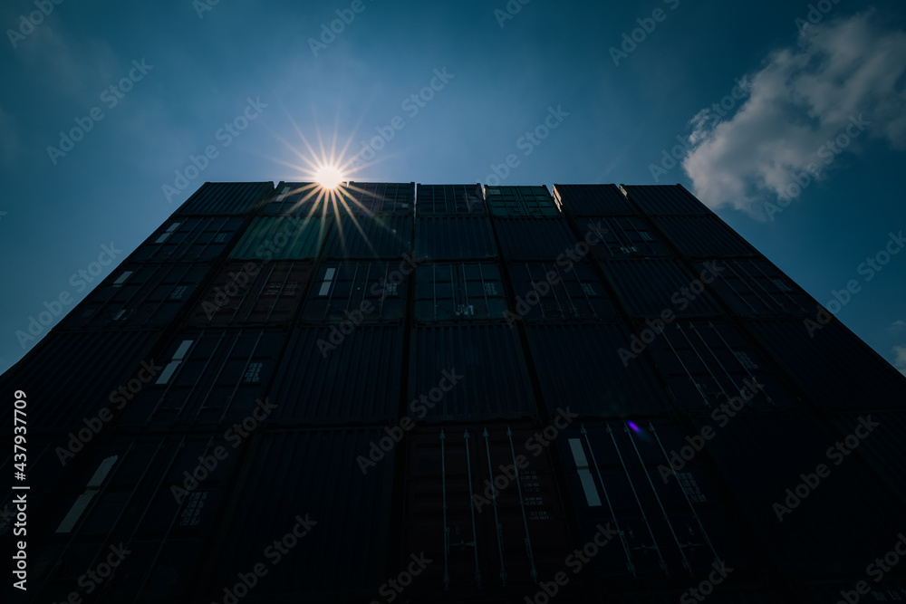 Fototapeta premium container with sun flair blue sky background