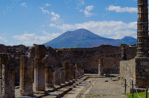 Famous landmark of ancient and historic city temple ruins with columns and walls on archeologic site museum Pompeji Pompeii excavation site in Italy near Naples and Vesuv Volcano photo