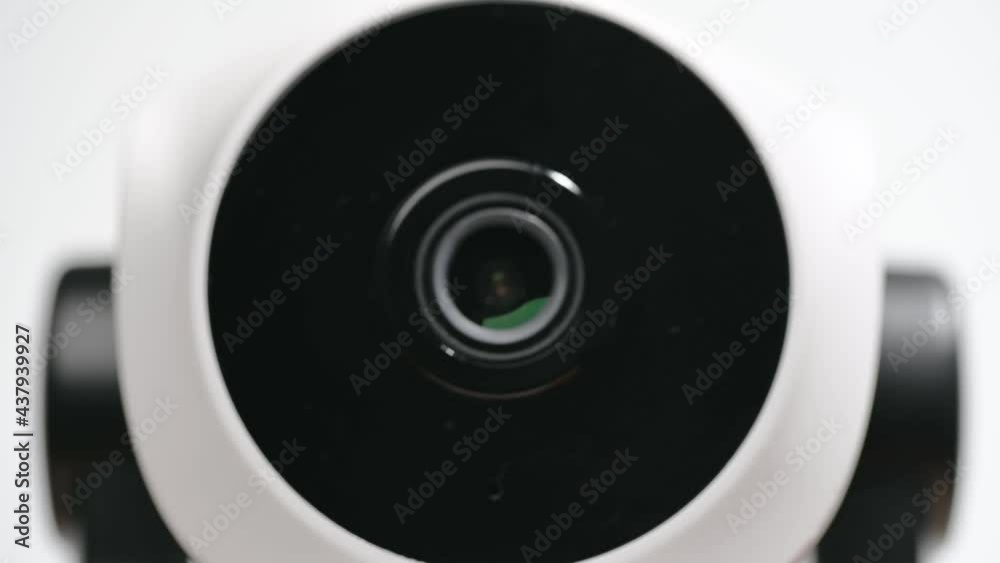 Surveillance IP Internet CCTV camera system remotely operated. Smartphone controlled home security camera moving filming around in 4k footage isolated on white background.
