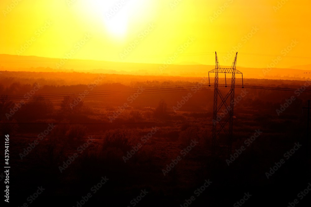 Sunset and Powerlines for Power and Communications