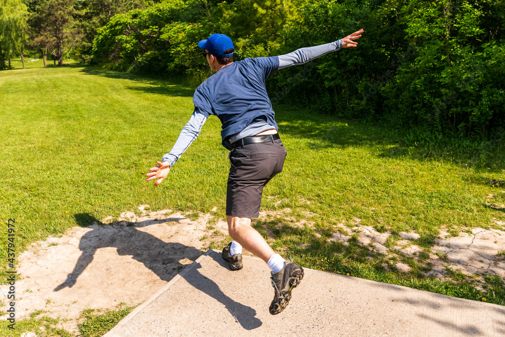 Disc golf is a flying disc sport in which players throw a disc at a