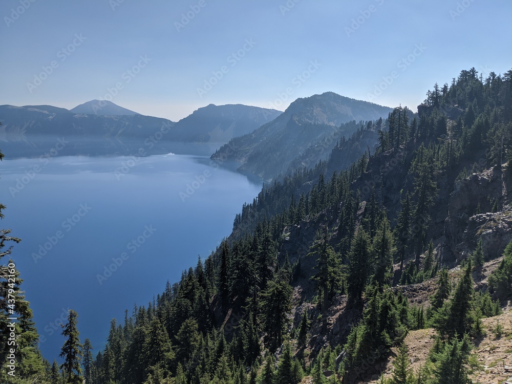 Crater Lake Oregon Blue water lake with trees surrounding